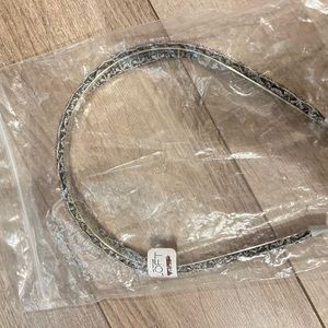 Loft silver colored head band.